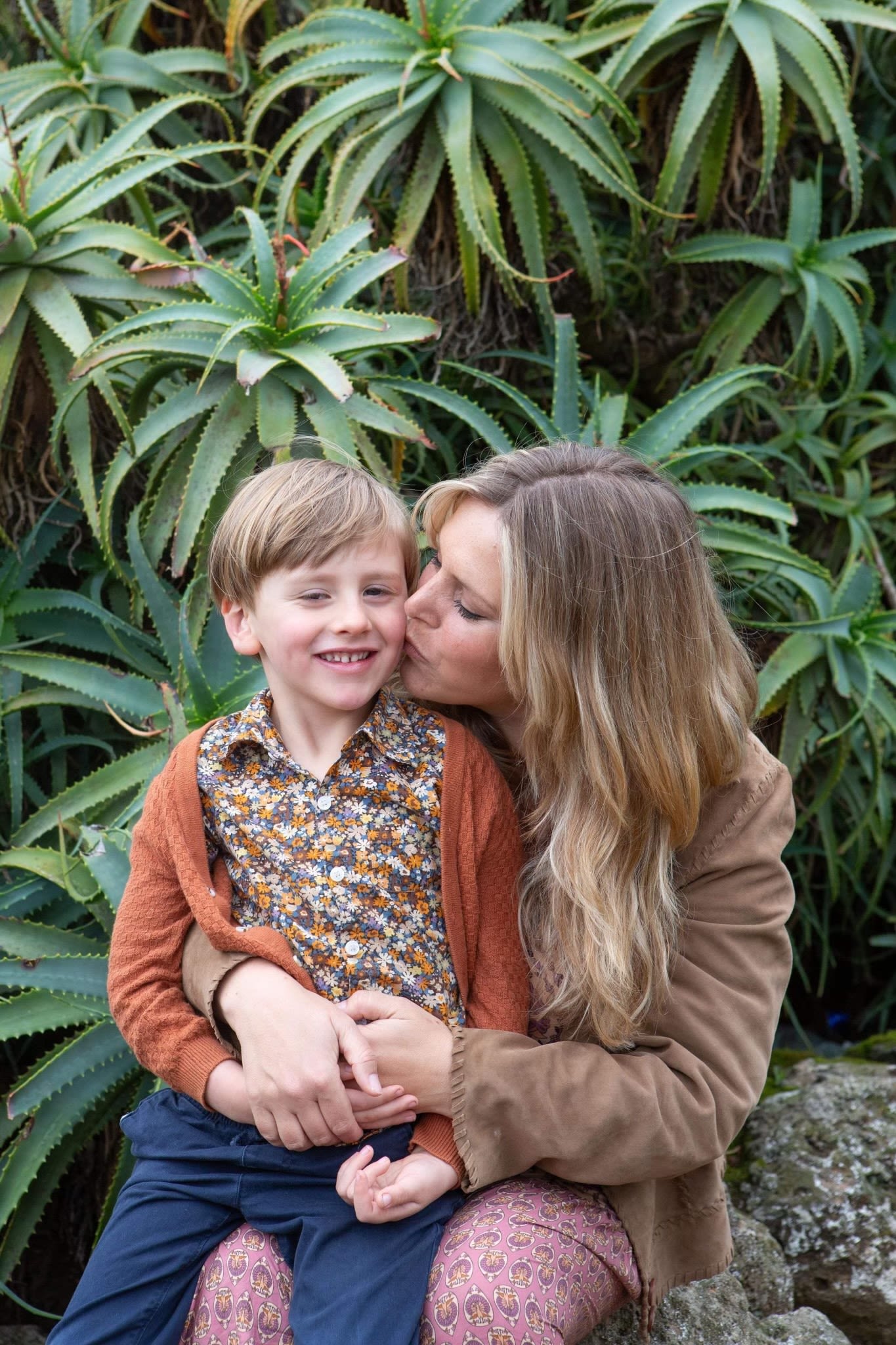 Mum kissing some 6 years old on the cheek